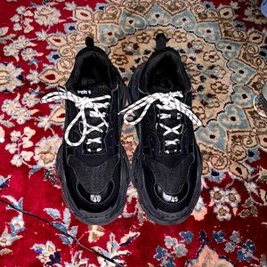 One time used black Balenciaga shoe .